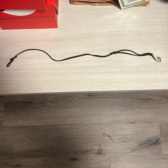 Never worn leather wrist wrap with small hook.  It is 17in in length - Picture 2 of 4